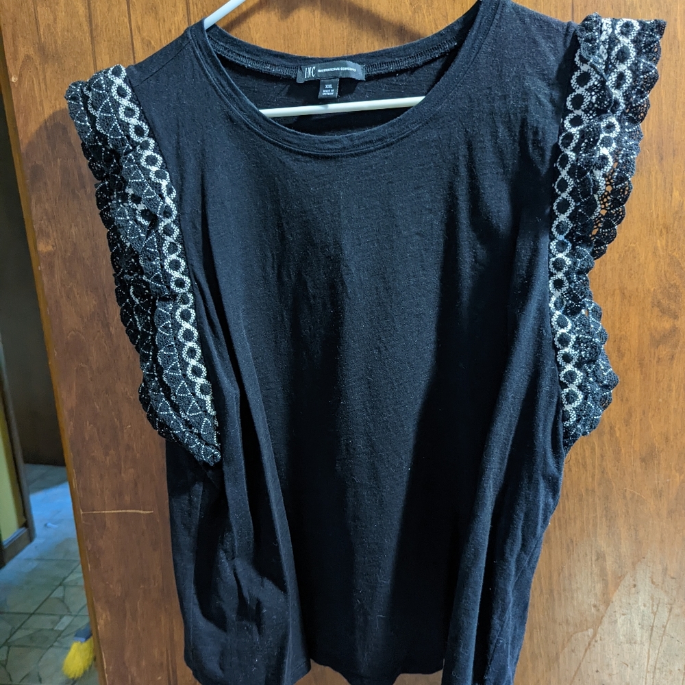 Black shirt with ruffly sleeves